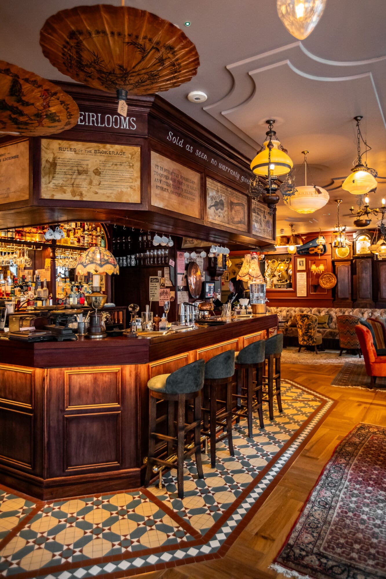 The brown wooden main bar at Mr Fogg's Pawnbrokers cocktail bar in Soho London