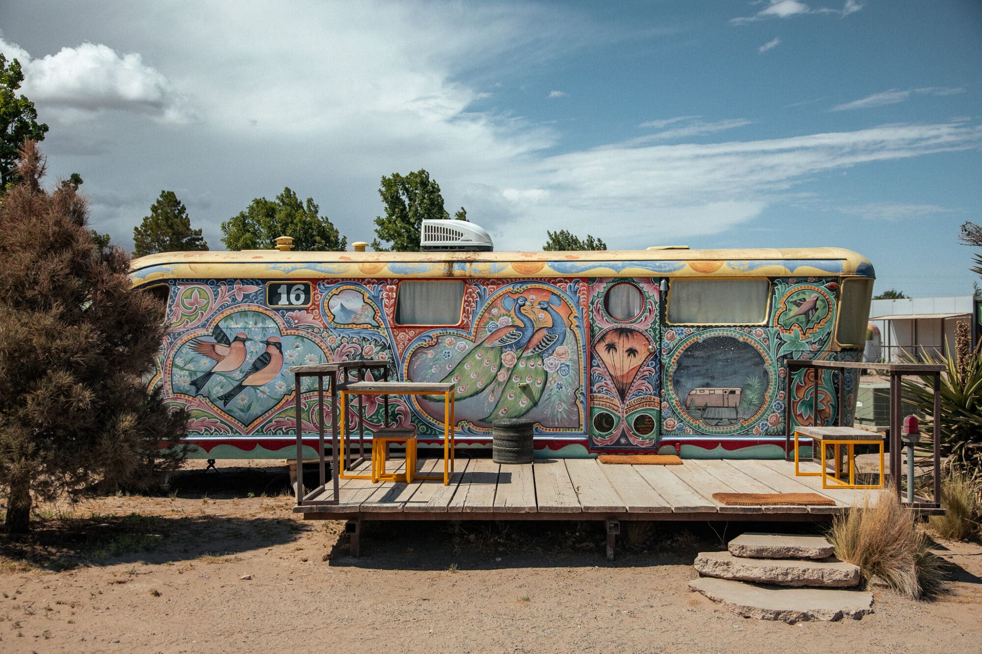 A colourful painted vintage trailer at El Cosmico, Marfa Texas Lodging