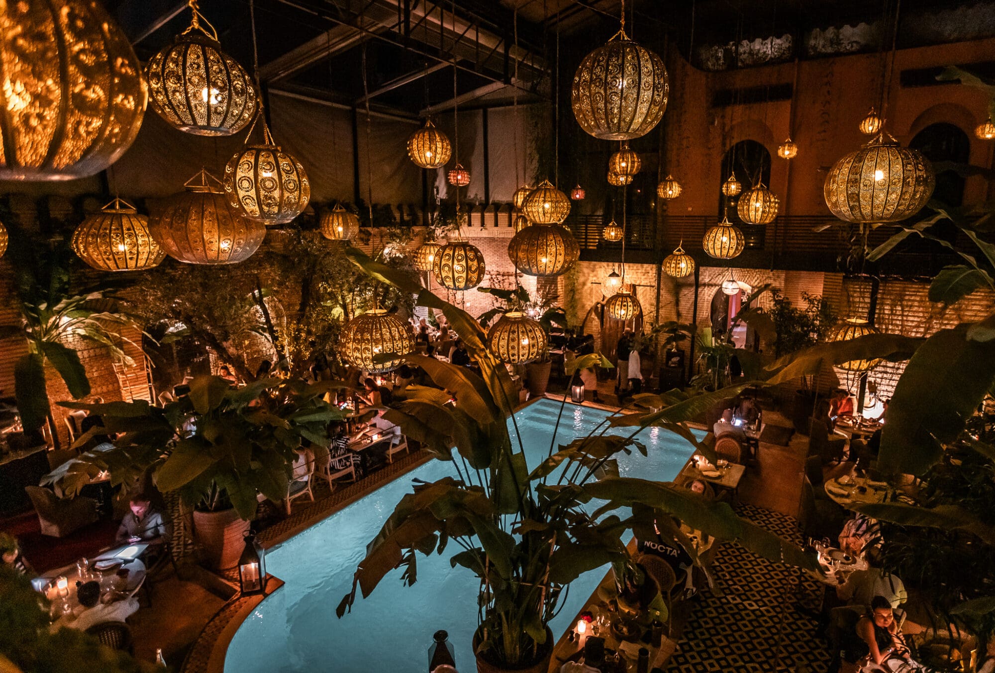 La Trattoria Restaurant Marrakech Morocco Lanterns over the pool at nighttime