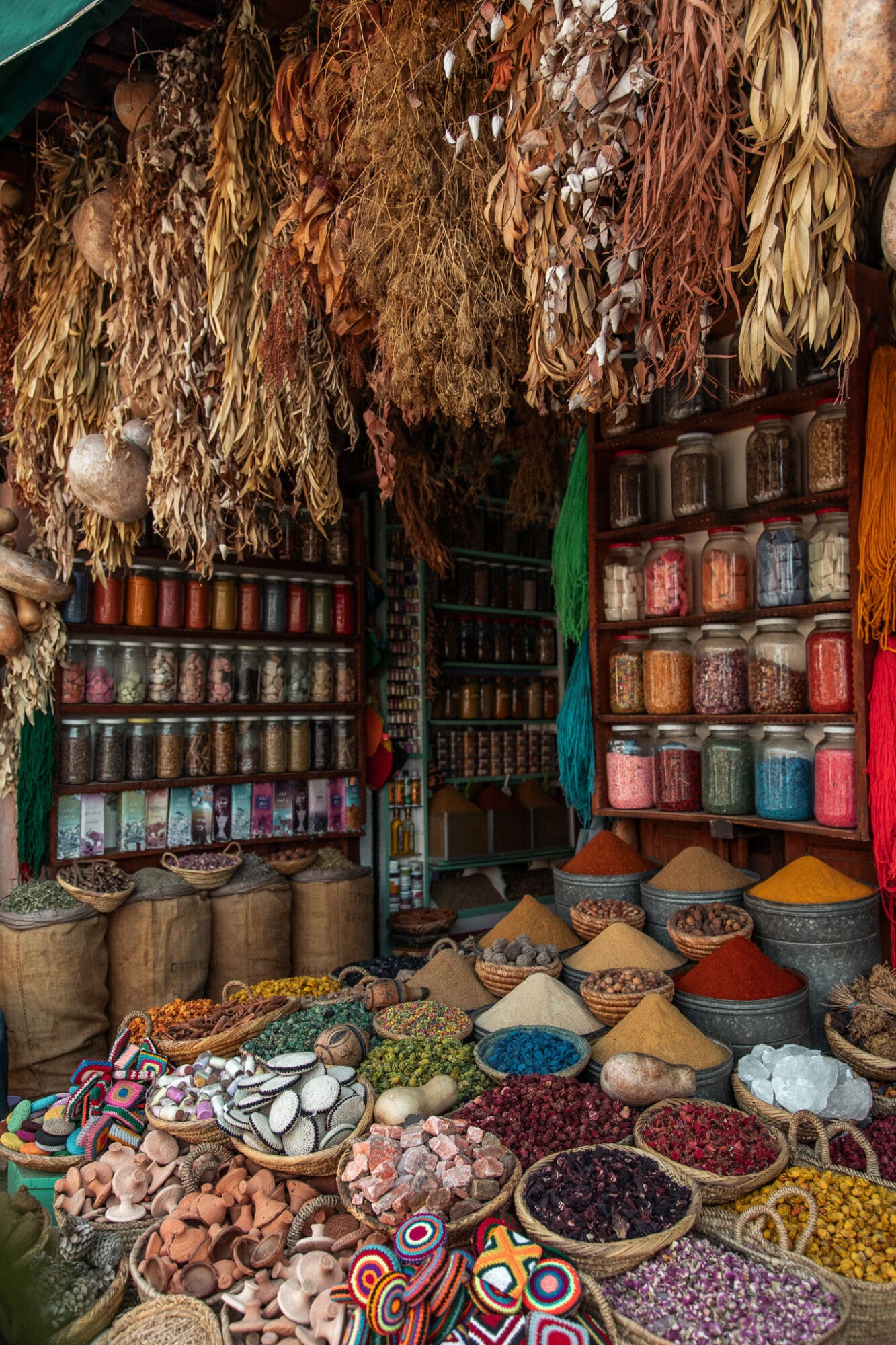 Piles of colourful spices spill out from a stall in the marrakech souks