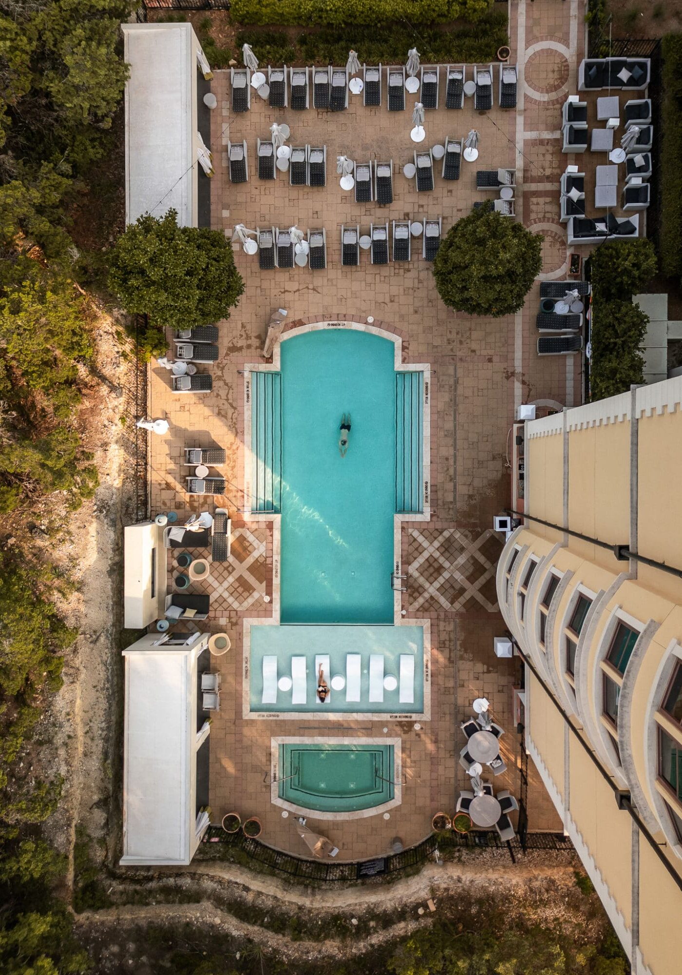 A drone photograph of the pool at Hotel Viata, Where to Stay in Austin Texas, Hotels in Austin