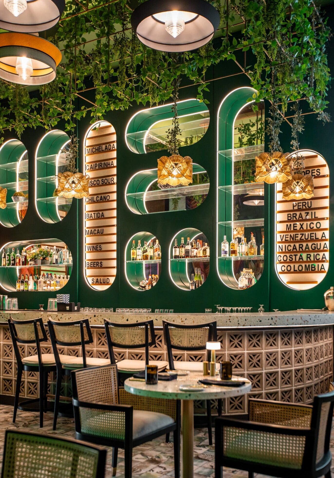 The green, modernist style bar at Zuka Restaurant, Sandals Royal Curacao