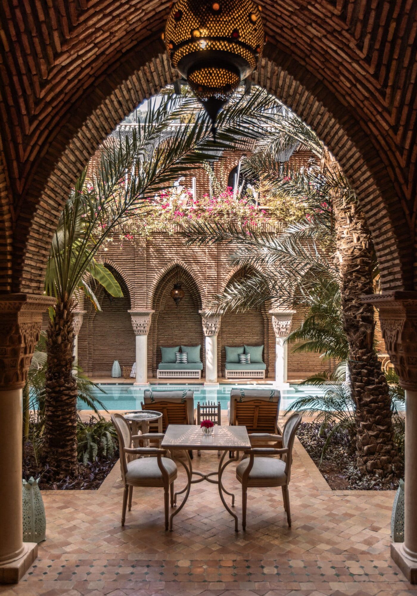 La Sultana Marrakech Review Pool Area through arches