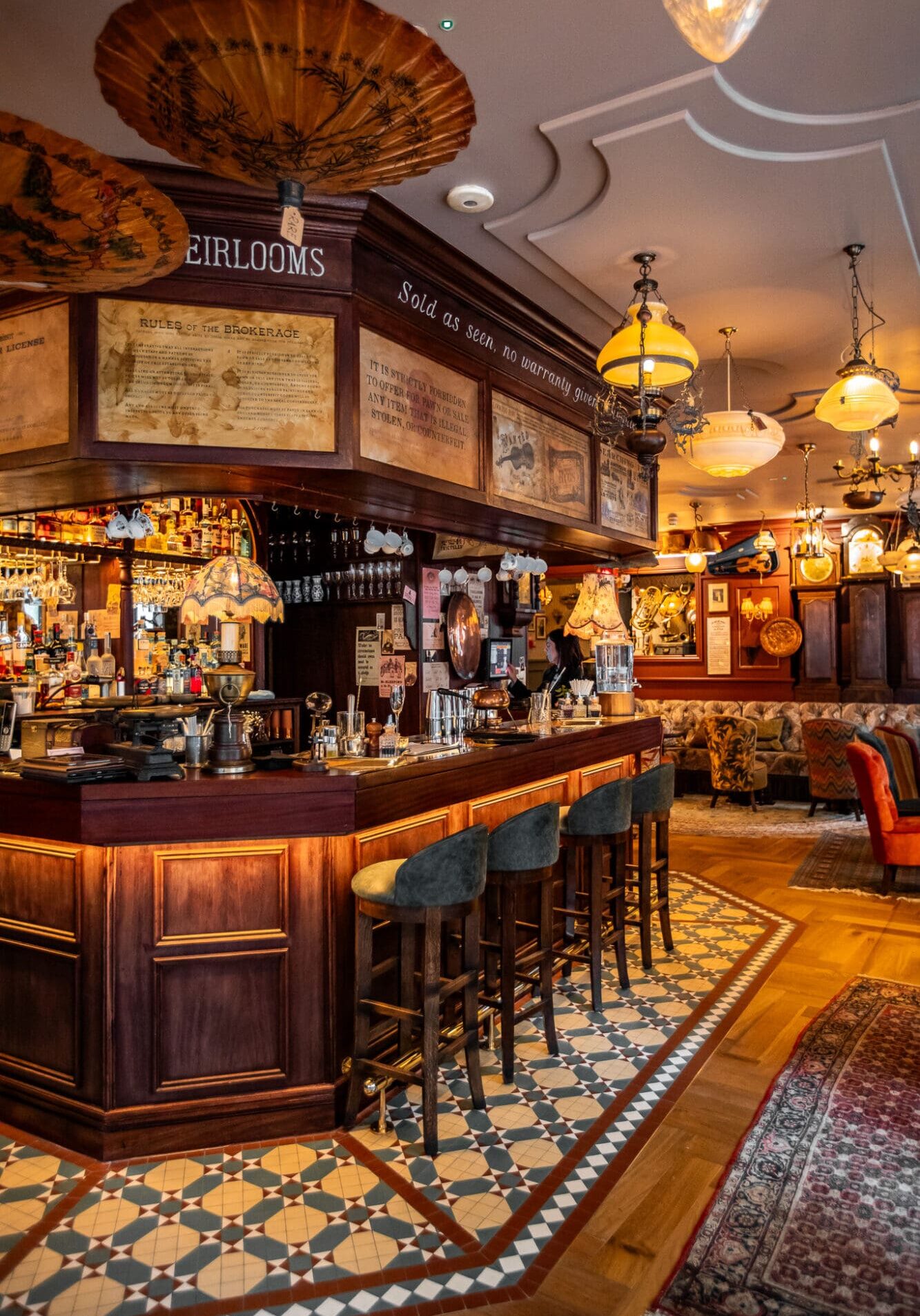 The brown wooden main bar at Mr Fogg's Pawnbrokers cocktail bar in Soho London